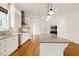 Modern kitchen featuring granite countertops, stainless appliances, and bright white cabinets at 1509 Heritage Reserve Ct, Wake Forest, NC 27587