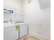 Laundry area with washer, dryer and overhead shelving at 1509 Heritage Reserve Ct, Wake Forest, NC 27587