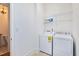 Bright laundry room with white appliances and shelving at 1509 Heritage Reserve Ct, Wake Forest, NC 27587