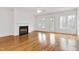 Spacious living room with a fireplace, large windows, and hardwood floors at 1509 Heritage Reserve Ct, Wake Forest, NC 27587