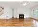 Open living area with hardwood floors, fireplace, and plenty of natural light at 1509 Heritage Reserve Ct, Wake Forest, NC 27587