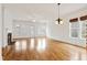 Bright, open-plan living space with hardwood floors, fireplace, and lots of natural light at 1509 Heritage Reserve Ct, Wake Forest, NC 27587