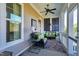Inviting outdoor screened porch featuring wicker furniture and neutral decor at 1509 Heritage Reserve Ct, Wake Forest, NC 27587