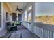 Relaxing screened porch with comfortable seating and views of the surrounding landscape at 1509 Heritage Reserve Ct, Wake Forest, NC 27587