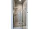 Modern shower with glass doors and light-colored tile at 1509 Heritage Reserve Ct, Wake Forest, NC 27587