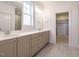 Bathroom with double vanity, quartz countertop, and linen closet at 201 Wash Hollow Dr, Wendell, NC 27591