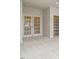 Bedroom featuring neutral carpet, French doors, and view into shelf lined room at 201 Wash Hollow Dr, Wendell, NC 27591