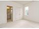Bright bedroom with neutral tones, closet, and doorway leading to a connected bathroom at 201 Wash Hollow Dr, Wendell, NC 27591
