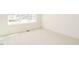 Bright bedroom with large window offering abundant natural light and neutral carpet at 201 Wash Hollow Dr, Wendell, NC 27591