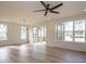 Bright dining area featuring hardwood floors, large windows, and sliding glass doors to the patio at 201 Wash Hollow Dr, Wendell, NC 27591