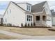Charming home featuring light siding and a manicured lawn on a sunny day at 201 Wash Hollow Dr, Wendell, NC 27591