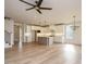 Bright kitchen featuring white cabinetry, stainless steel appliances, and hardwood floors at 201 Wash Hollow Dr, Wendell, NC 27591