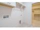 Convenient laundry room with built in cabinets and shelving for added storage at 201 Wash Hollow Dr, Wendell, NC 27591