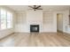 Spacious living room featuring a fireplace with custom built-ins and wood floors at 201 Wash Hollow Dr, Wendell, NC 27591