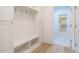 Functional mudroom with storage bench, cubbies and hooks for organized entry at 201 Wash Hollow Dr, Wendell, NC 27591
