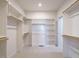 Spacious walk-in closet with custom shelving and ample storage space for organization at 201 Wash Hollow Dr, Wendell, NC 27591