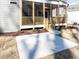 A concrete patio and wood deck steps lead to the screen porch at 220 Big Bradley Dr, Wendell, NC 27591