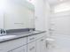 Bright bathroom featuring a double sink vanity with grey countertops and a shower-tub combo at 220 Big Bradley Dr, Wendell, NC 27591