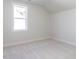 A bright, carpeted room with a large window offers a neutral space ready for personalization at 220 Big Bradley Dr, Wendell, NC 27591