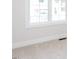 Bright bedroom with neutral carpet, white walls, and ample natural light from the windows at 220 Big Bradley Dr, Wendell, NC 27591