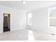 Bright and airy bedroom with plush carpet and two large windows at 220 Big Bradley Dr, Wendell, NC 27591