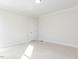 This bedroom features neutral carpeting, base molding, and a closet door, offering a blank slate for personalization at 220 Big Bradley Dr, Wendell, NC 27591