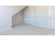 This bedroom offers neutral carpeting, a closet and base molding throughout at 220 Big Bradley Dr, Wendell, NC 27591