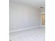 This unfurnished bedroom offers neutral carpeting and a glass paned door at 220 Big Bradley Dr, Wendell, NC 27591