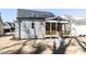 Back of home with a screened porch, siding, and gray roof at 220 Big Bradley Dr, Wendell, NC 27591