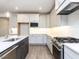 Well-lit kitchen featuring stainless steel oven, gray cabinets, white countertops, and a stylish faucet at 220 Big Bradley Dr, Wendell, NC 27591