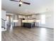 Open floorplan with a view of the kitchen and dining room; hardwood floors and modern fixtures at 220 Big Bradley Dr, Wendell, NC 27591