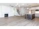 Spacious open-plan living room and kitchen with hardwood floors and modern finishes at 220 Big Bradley Dr, Wendell, NC 27591