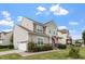 Attractive two-story home with stone accents, a well-manicured lawn, and a charming front porch at 7124 Hinman Ln, Apex, NC 27539