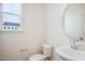 Clean powder room with an oval mirror and modern fixtures at 849 Parc Townes Dr # 11, Wendell, NC 27591