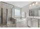 Well-lit bathroom features a separate glass shower and bathtub combo at 232 Big Barn Dr, Wendell, NC 27591