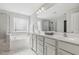 Luxurious bathroom featuring double sinks, a soaking tub, and a glass-enclosed shower at 232 Big Barn Dr, Wendell, NC 27591