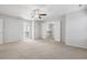 Expansive bedroom features plush carpeting, a ceiling fan, and a walk-in closet at 232 Big Barn Dr, Wendell, NC 27591