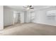 Well-lit bedroom with neutral walls, carpet flooring, and double windows at 232 Big Barn Dr, Wendell, NC 27591