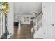 Inviting foyer with hardwood floors seamlessly connecting to the open-concept kitchen and living area at 232 Big Barn Dr, Wendell, NC 27591