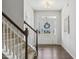 Bright foyer with hardwood floors, staircase, and glass-paneled front door creating an inviting entrance at 232 Big Barn Dr, Wendell, NC 27591