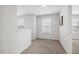 Bright hallway with carpet flooring and white walls and trim at 232 Big Barn Dr, Wendell, NC 27591