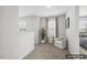 Staged upstairs hallway with neutral carpet, white walls, and a seating area at 232 Big Barn Dr, Wendell, NC 27591