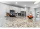 Modern kitchen features granite counters, stainless steel appliances, and white cabinetry at 232 Big Barn Dr, Wendell, NC 27591