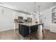 Open-concept kitchen showcases an island with granite counters and pendant lighting at 232 Big Barn Dr, Wendell, NC 27591