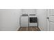 Bright laundry room featuring a washer and dryer set and gray vinyl flooring at 232 Big Barn Dr, Wendell, NC 27591