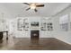 Open-concept living space featuring a fireplace, built-in shelving, and seamless flow to the kitchen at 232 Big Barn Dr, Wendell, NC 27591