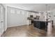Open concept space with view of kitchen with an island and stainless steel appliances at 232 Big Barn Dr, Wendell, NC 27591