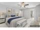 Spacious main bedroom with a ceiling fan, neutral decor, and an ensuite bathroom at 232 Big Barn Dr, Wendell, NC 27591