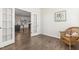 Office space featuring dark hardwood flooring and an open doorway to the kitchen at 232 Big Barn Dr, Wendell, NC 27591