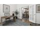 Bright staged office space with hardwood flooring and a natural wood desk at 232 Big Barn Dr, Wendell, NC 27591